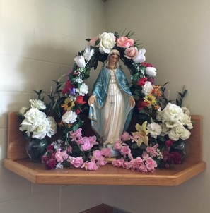 Statue of Mary with flowers