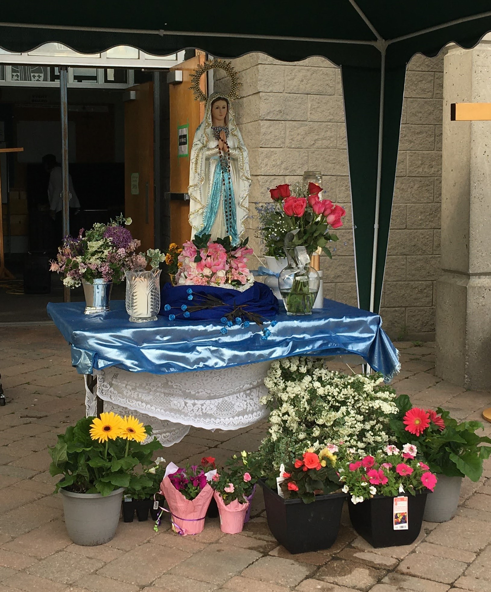 Statue of Our Lady with crown and flowers