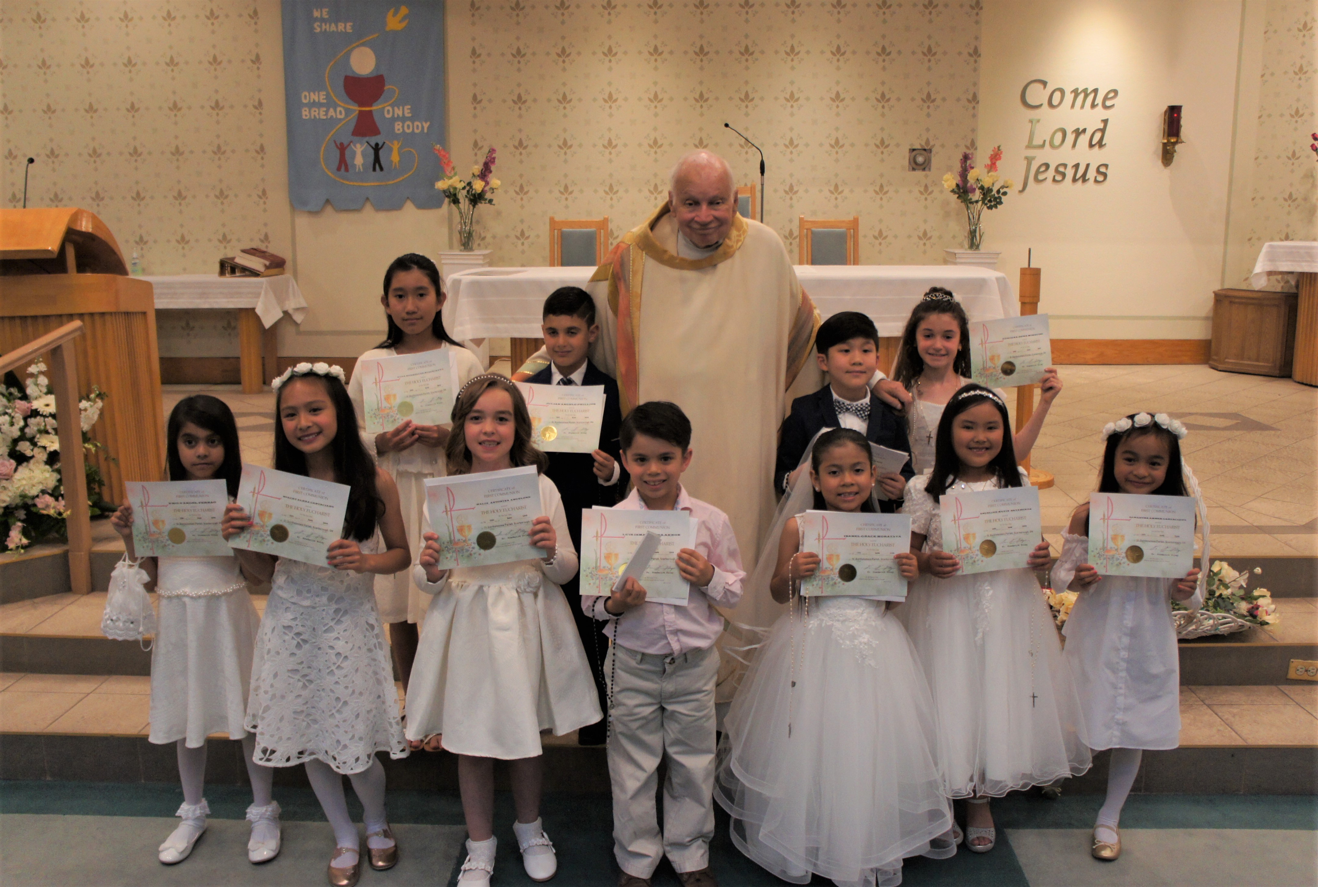 Children making their First Communion with Fr. Foley