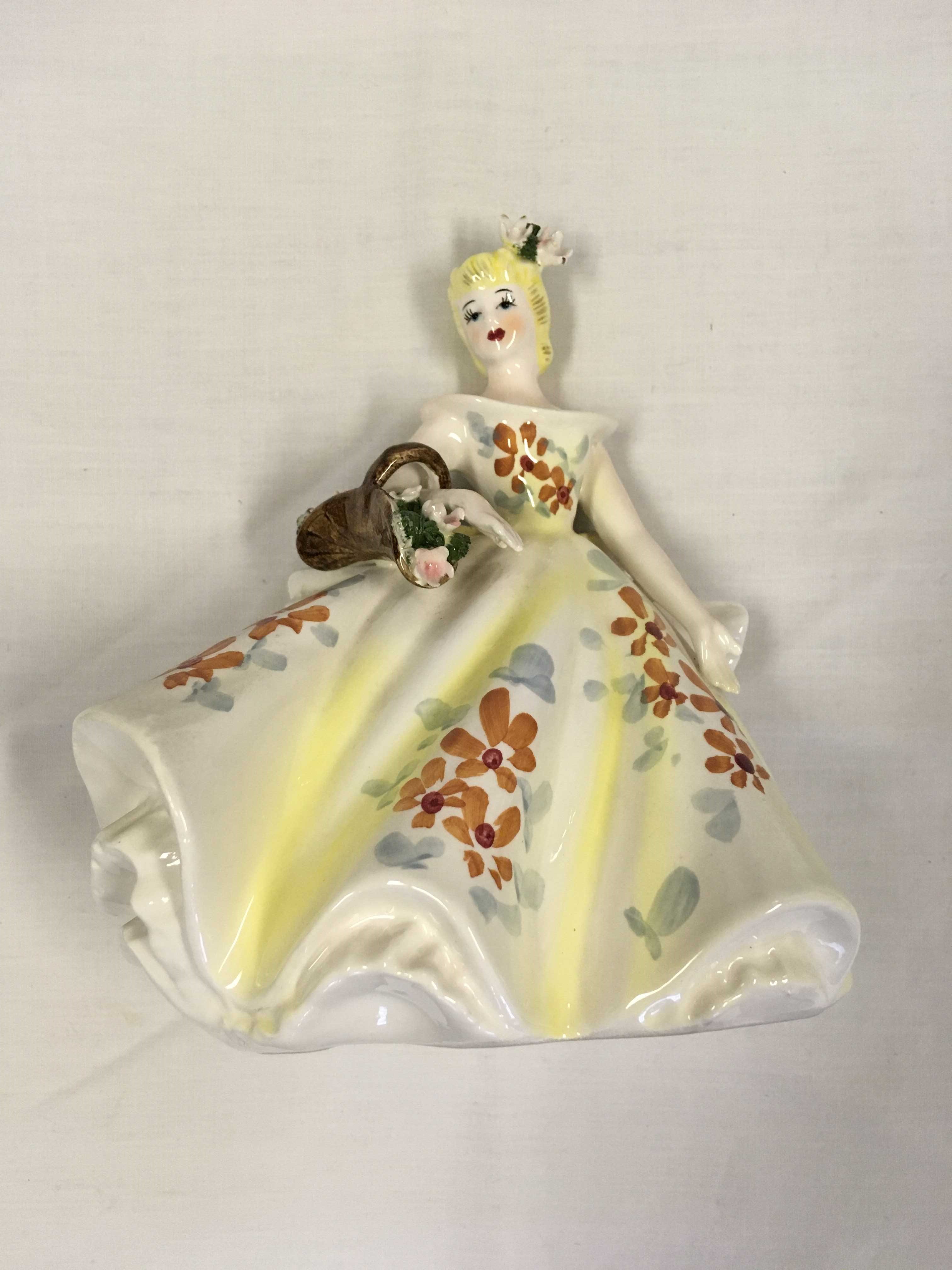 Lady in yellow figurine