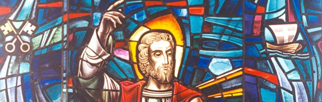 Stained glass window depicting the face of St. Bartholomew